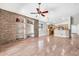 Open floor plan living room leading into the kitchen with views of the backyard at 8465 W Andrea Dr, Peoria, AZ 85383