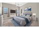 Serene bedroom with high ceilings, plush carpet, and an abundance of natural light at 8465 W Andrea Dr, Peoria, AZ 85383