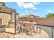 Outdoor kitchen with a built-in barbecue, bar seating, and tiled countertops at 8465 W Andrea Dr, Peoria, AZ 85383