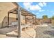 Outdoor living with covered patio, built-in grill and barbecue, and ample seating at 8465 W Andrea Dr, Peoria, AZ 85383