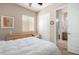 Bedroom featuring neutral paint, ceiling fan, and ensuite bathroom access at 8647 W Lariat Ln, Peoria, AZ 85383