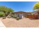 Home exterior showing desert landscaping, and exterior privacy gate at 8647 W Lariat Ln, Peoria, AZ 85383