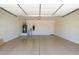 Spacious garage with water heater, water softener, and epoxy flooring at 8647 W Lariat Ln, Peoria, AZ 85383