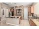 Open kitchen featuring wood cabinetry, granite countertops, and stainless steel appliances at 8647 W Lariat Ln, Peoria, AZ 85383