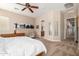 Serene primary bedroom with ample natural light, tasteful decor, and an ensuite bathroom at 8647 W Lariat Ln, Peoria, AZ 85383