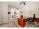 Office featuring a large wooden desk, office chair, and natural lighting at 8647 W Lariat Ln, Peoria, AZ 85383