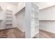 Walk-in closet with carpeting and open shelving at 8647 W Lariat Ln, Peoria, AZ 85383