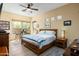 Comfortable bedroom with a queen bed, two windows, and stylish decor at 9543 E Kiisa Dr, Scottsdale, AZ 85262