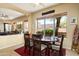 Comfortable dining room adjacent to the living room featuring a large window and a wood table set at 9543 E Kiisa Dr, Scottsdale, AZ 85262