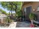 Home's front entrance featuring desert landscaping and an iron-clad front door at 9543 E Kiisa Dr, Scottsdale, AZ 85262