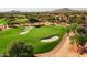 Beautifully manicured golf course with sand traps and desert landscaping nestled in a scenic, upscale residential area at 9543 E Kiisa Dr, Scottsdale, AZ 85262