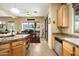 Bright kitchen with a dining nook, stainless steel appliances, and sliding door access to the backyard at 9543 E Kiisa Dr, Scottsdale, AZ 85262