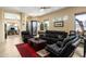 Inviting living room features comfortable leather seating, a cozy rug, and an abundance of natural light at 9543 E Kiisa Dr, Scottsdale, AZ 85262