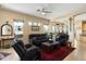 Spacious living room boasts natural light, tile flooring, and comfortable seating at 9543 E Kiisa Dr, Scottsdale, AZ 85262