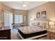 Well-lit bedroom with modern furnishings, soft carpet, and a large window at 10401 N Saguaro Blvd # 123, Fountain Hills, AZ 85268
