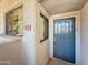 Charming front entrance featuring a blue door and a visible house number at 10401 N Saguaro Blvd # 123, Fountain Hills, AZ 85268