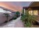 Charming backyard featuring stone pathway and lush landscaping, perfect for outdoor relaxation and enjoying the desert sunset at 13533 N 91St Way, Scottsdale, AZ 85260