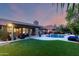A stunning backyard featuring a refreshing pool, lounge chairs, and an outdoor seating area at 13533 N 91St Way, Scottsdale, AZ 85260