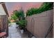 Landscaped backyard with stone pavers and block wall offering privacy and desert charm at 13533 N 91St Way, Scottsdale, AZ 85260