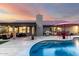 Beautiful backyard featuring a refreshing pool, outdoor kitchen, and an outdoor seating area at 13533 N 91St Way, Scottsdale, AZ 85260