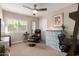 Bedroom with a ceiling fan, natural light, and an inviting seating area at 13533 N 91St Way, Scottsdale, AZ 85260