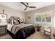 Bedroom featuring a ceiling fan, neutral color palette, and plantation shutters at 13533 N 91St Way, Scottsdale, AZ 85260