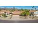 Beautiful home showcasing its expansive driveway, desert landscaping, and a tile roof, complemented by scenic mountain views at 13533 N 91St Way, Scottsdale, AZ 85260