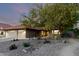 Charming home featuring desert landscaping, a three car garage, and tile roof at 13533 N 91St Way, Scottsdale, AZ 85260