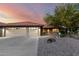 Charming home featuring a three car garage, desert landscaping, and tile roof at 13533 N 91St Way, Scottsdale, AZ 85260