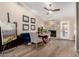 Living room features a stone fireplace, hardwood floors, and natural light at 13533 N 91St Way, Scottsdale, AZ 85260