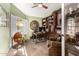 Bright home office with hardwood floors, custom bookshelves, and natural light at 13533 N 91St Way, Scottsdale, AZ 85260