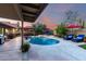 A beautiful backyard featuring a refreshing pool, lounge chairs, and desert landscaping at 13533 N 91St Way, Scottsdale, AZ 85260