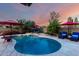 Inviting pool with lounge chairs and umbrellas, perfect for relaxation and outdoor enjoyment at 13533 N 91St Way, Scottsdale, AZ 85260