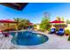 Beautiful pool area with lounge chairs, mature trees, and a serene desert backdrop at 13533 N 91St Way, Scottsdale, AZ 85260