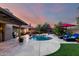 Beautiful backyard featuring a refreshing pool, lounge chairs, and desert landscaping at 13533 N 91St Way, Scottsdale, AZ 85260
