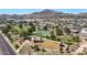 Panoramic aerial view capturing the community park, playground, basketball court, and lush green space at 1511 E Carol Ave, Phoenix, AZ 85020