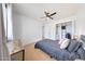Bright bedroom features wood floors, and closet space at 1511 E Carol Ave, Phoenix, AZ 85020