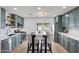 Contemporary kitchen boasting stainless steel appliances, modern lighting fixtures, and a spacious design at 1511 E Carol Ave, Phoenix, AZ 85020