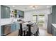 Stylish eat-in kitchen featuring stainless steel appliances, modern lighting, and a convenient layout at 1511 E Carol Ave, Phoenix, AZ 85020