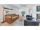 Cozy living room featuring a modern couch, fireplace, and views of the landscape at 1511 E Carol Ave, Phoenix, AZ 85020