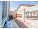 This low maintenance backyard features gravel, block wall fencing, and concrete walkway at 1550 W Saint Kateri Dr, Phoenix, AZ 85041