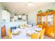 Cozy dining area features a large, round dining table with seating for eight people and a built-in hutch at 1550 W Saint Kateri Dr, Phoenix, AZ 85041