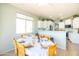 Bright dining area features a large window and a beautifully set table for a special occasion at 1550 W Saint Kateri Dr, Phoenix, AZ 85041