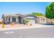 A single-story house with a three-car garage, desert landscaping, and stone veneer accents at 1550 W Saint Kateri Dr, Phoenix, AZ 85041