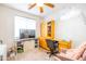 Office area with media center, work space and two pink chairs at 1550 W Saint Kateri Dr, Phoenix, AZ 85041