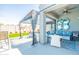 Stylish outdoor patio boasts comfortable seating, decorative accents, and a retractable awning for shade at 1550 W Saint Kateri Dr, Phoenix, AZ 85041