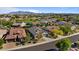 Aerial view of homes in a residential neighborhood with desert landscaping and mountain views at 15665 W Coronado Rd, Goodyear, AZ 85395