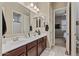 Bathroom with double sink vanity and modern fixtures at 15665 W Coronado Rd, Goodyear, AZ 85395