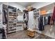 Walk-in closet with built-in shelving and hanging storage space at 15665 W Coronado Rd, Goodyear, AZ 85395