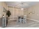 Cozy dining area featuring a modern chandelier and decorative wall paneling at 15665 W Coronado Rd, Goodyear, AZ 85395